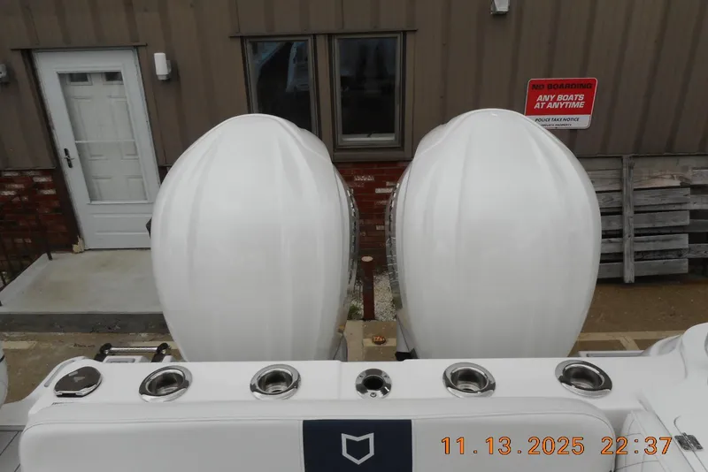 Slide: The Image of 2025 Sea Fox 288 Traveler boat engines, docked with no boarding sign visible. - 38