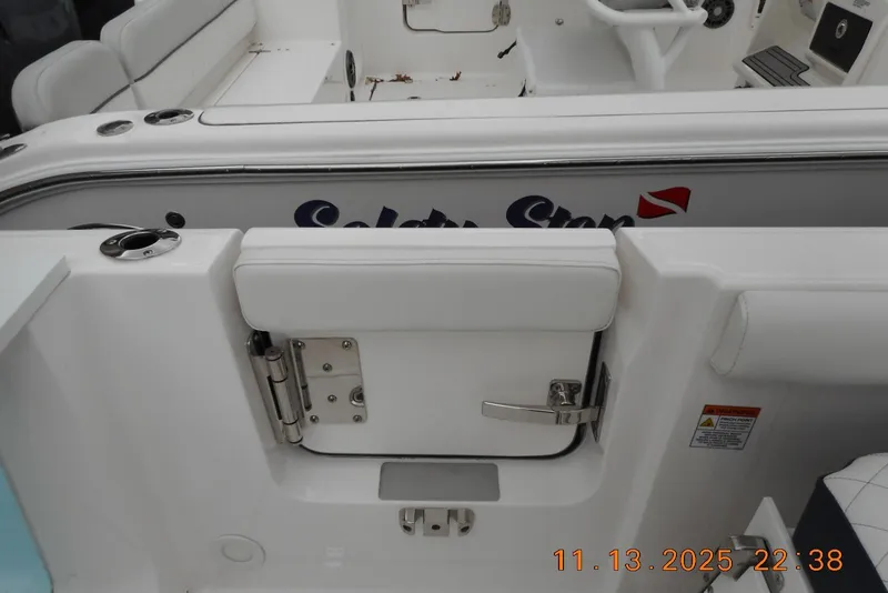 Slide: The Image of 2025 Sea Fox 288 Traveler boat interior with white seating and safety features. - 39