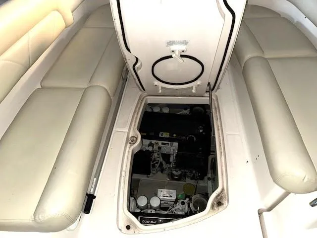Slide: The Image of 2007 Tiara Yachts 4300 Sovran engine compartment with open hatch and cushioned seating. - 10