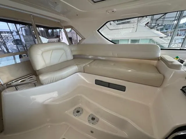 Slide: The Image of 2007 Tiara Yachts 4300 Sovran interior with cream leather seating and large windows. - 18