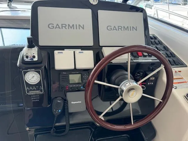 Slide: The Image of 2007 Tiara Yachts 4300 Sovran helm with Garmin displays and wooden steering wheel. - 20