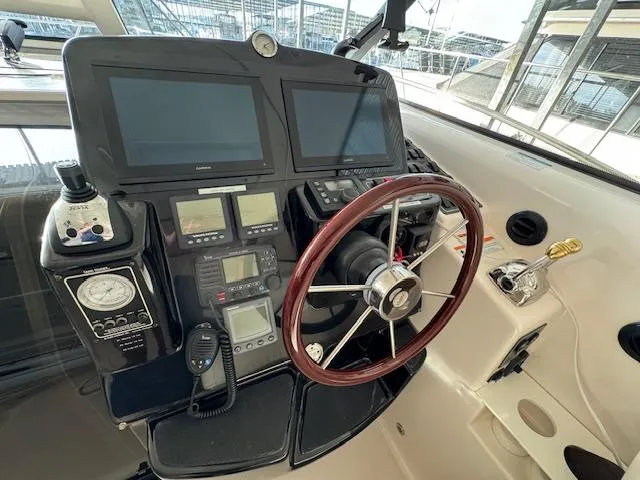 Slide: The Image of Helm of 2007 Tiara Yachts 4300 Sovran with navigation screens and controls. - 21