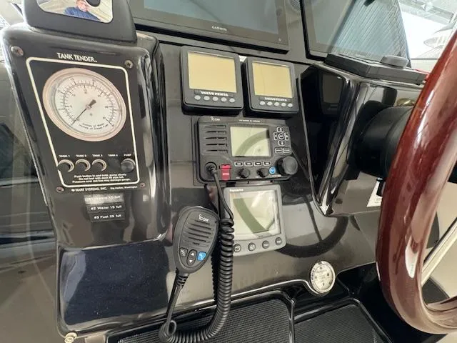 Slide: The Image of Control panel of a 2007 Tiara Yachts 4300 Sovran with gauges and communication equipment. - 23