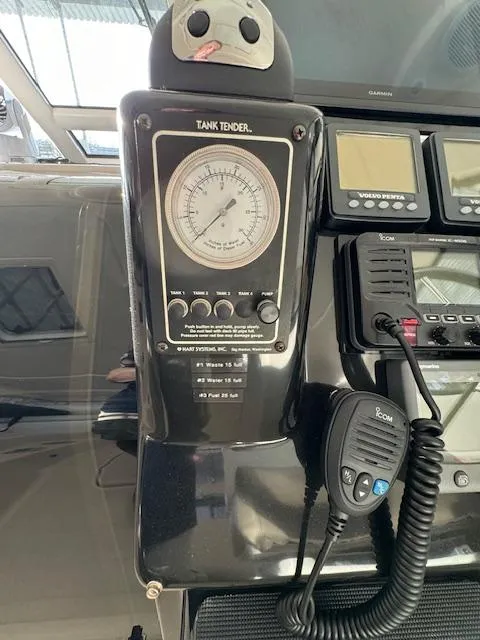 Slide: The Image of 2007 Tiara Yachts 4300 Sovran dashboard with tank tender and communication equipment. - 25