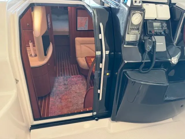 Slide: The Image of 2007 Tiara Yachts 4300 Sovran interior with helm, seating, and cabin view. - 28