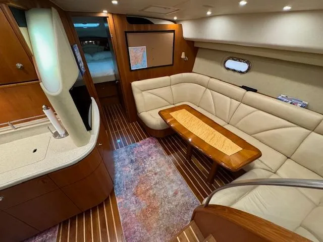 Slide: The Image of Luxurious 2007 Tiara Yachts 4300 Sovran interior with elegant seating and wooden accents. - 29