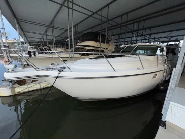 Slide: The Image of 2007 Tiara Yachts 4300 Sovran docked in a covered marina. - 3
