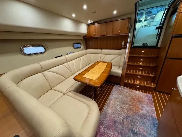 Slide: The Image of Luxurious interior of 2007 Tiara Yachts 4300 Sovran with plush seating and elegant wood finishes. - 32
