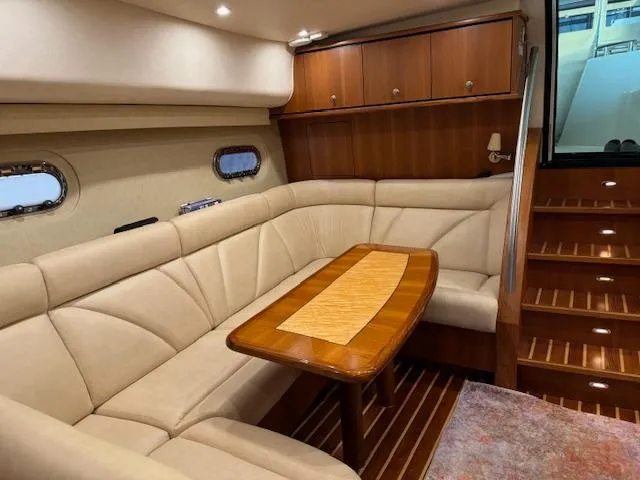 Slide: The Image of Luxurious interior of 2007 Tiara Yachts 4300 Sovran with elegant seating and wooden accents. - 33