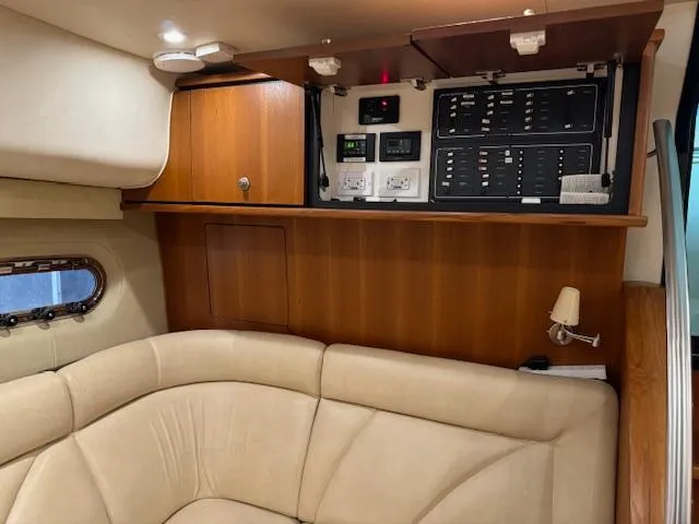 Slide: The Image of 2007 Tiara Yachts 4300 Sovran interior with beige seating and control panel. - 34