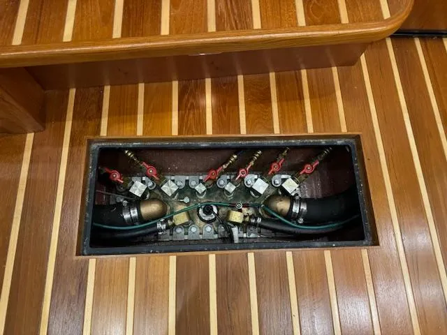 Slide: The Image of Engine compartment of 2007 Tiara Yachts 4300 Sovran with visible valves and hoses. - 37