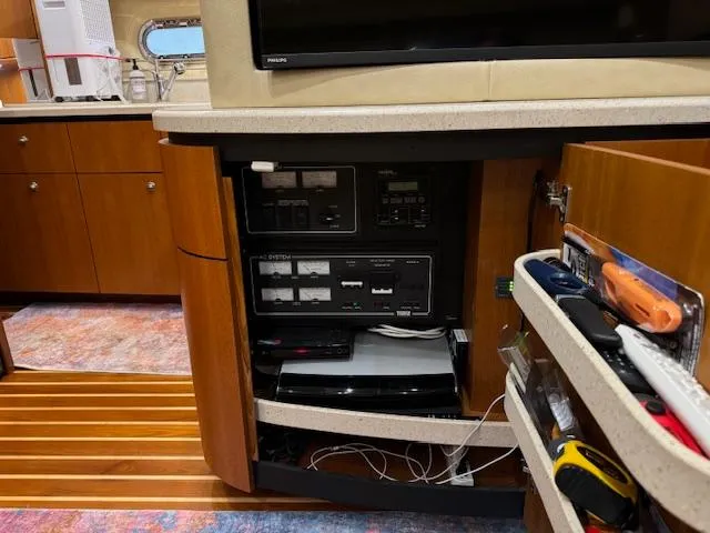 Slide: The Image of 2007 Tiara Yachts 4300 Sovran interior with control panel and storage compartments. - 40