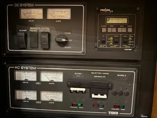 Slide: The Image of Electrical control panel of a 2007 Tiara Yachts 4300 Sovran, featuring DC and AC systems. - 41