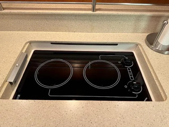 Slide: The Image of 2007 Tiara Yachts 4300 Sovran kitchen with sleek electric stovetop. - 44