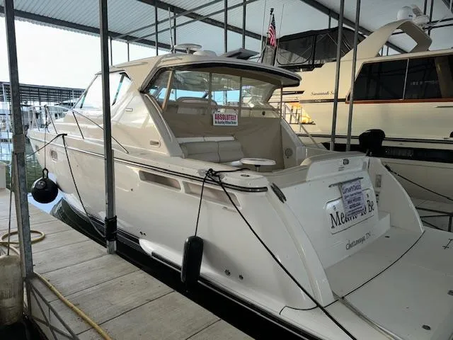 Slide: The Image of 2007 Tiara Yachts 4300 Sovran docked in a covered marina. - 5