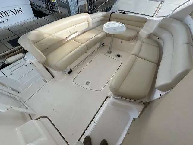 Slide: The Image of 2007 Tiara Yachts 4300 Sovran interior with beige seating and round table. - 8