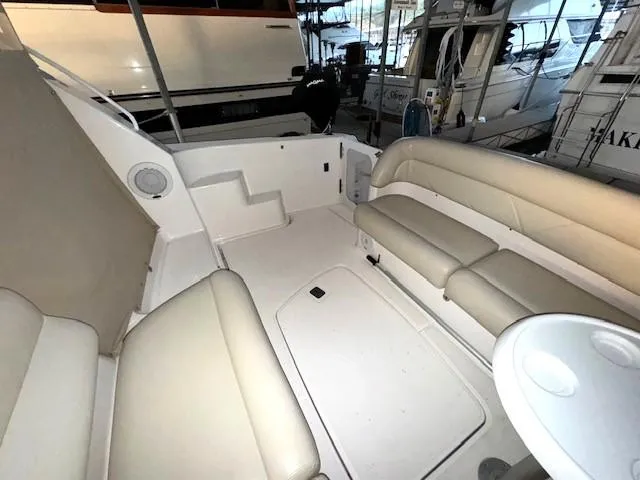 Slide: The Image of 2007 Tiara Yachts 4300 Sovran interior with beige seating and white deck. - 9