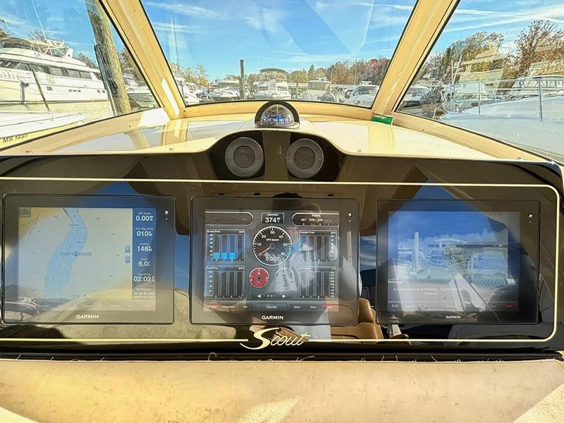 Slide: The Image of Dashboard of a 2016 Scout 350 LXF boat with Garmin navigation displays. - 11