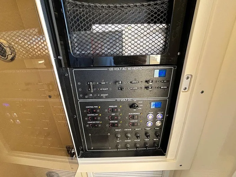 Slide: The Image of Control panel of a 2016 Scout 350 LXF boat, featuring various switches and indicators. - 26