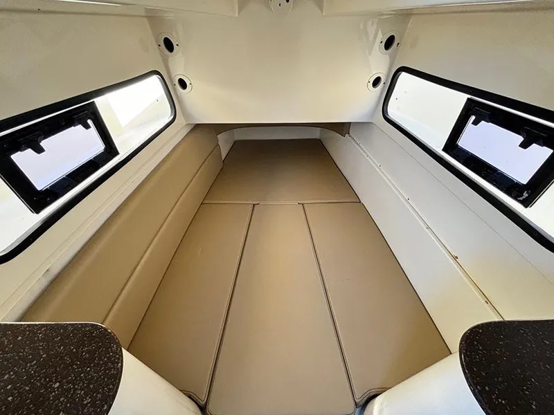 Slide: The Image of 2016 Scout 350 LXF cabin interior with cushioned seating and windows. - 30