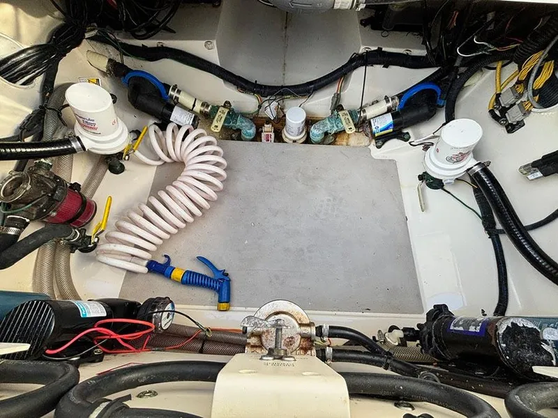 Slide: The Image of Engine compartment of 2016 Scout 350 LXF boat with hoses and wiring. - 7