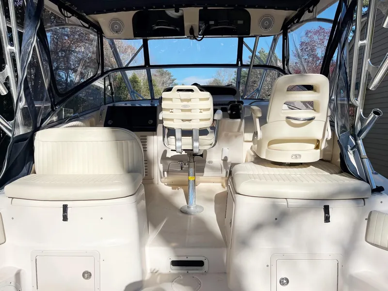 Slide: The Image of 2003 Grady-White 330 Express boat interior with seating and helm. - 10