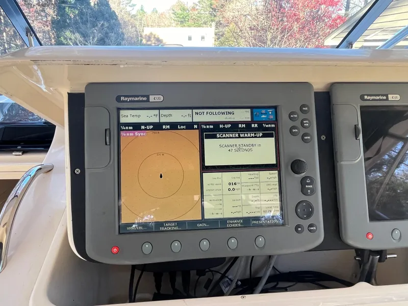Slide: The Image of Raymarine navigation system on 2003 Grady-White 330 Express boat dashboard. - 18