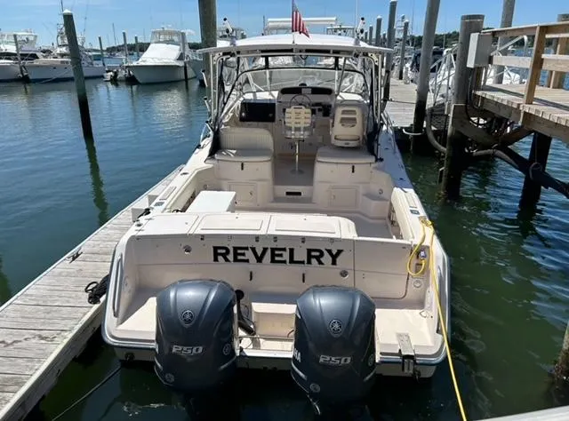 Slide: The Image of 2003 Grady-White 330 Express boat docked with twin Yamaha engines. - 2