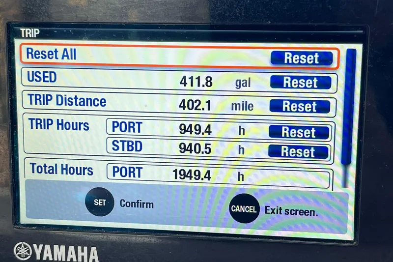 Slide: The Image of Yamaha display showing trip data: 411.8 gallons used, 402.1 miles traveled, 2003 Grady-White 330 - 20