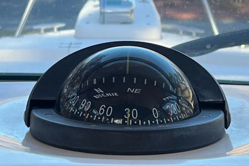 Slide: The Image of Compass on 2003 Grady-White 330 Express boat dashboard. - 21