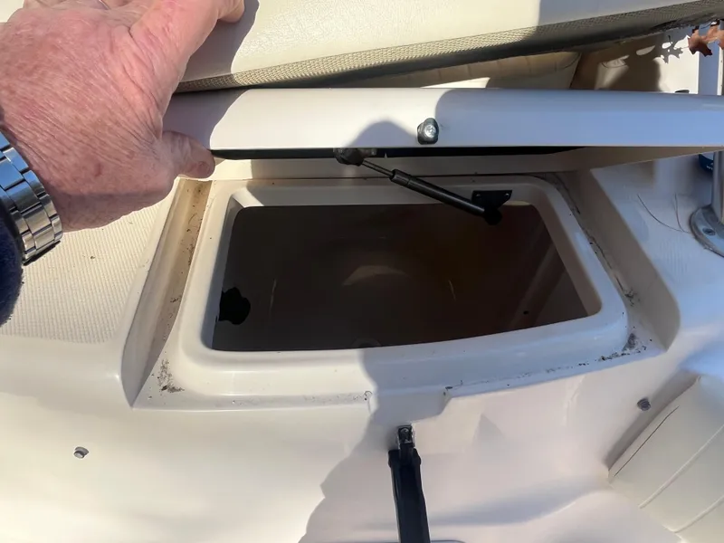 Slide: The Image of Open storage compartment on 2003 Grady-White 330 Express boat deck. - 25