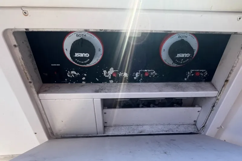 Slide: The Image of Control panel of a 2003 Grady-White 330 Express boat with dual switches. - 29