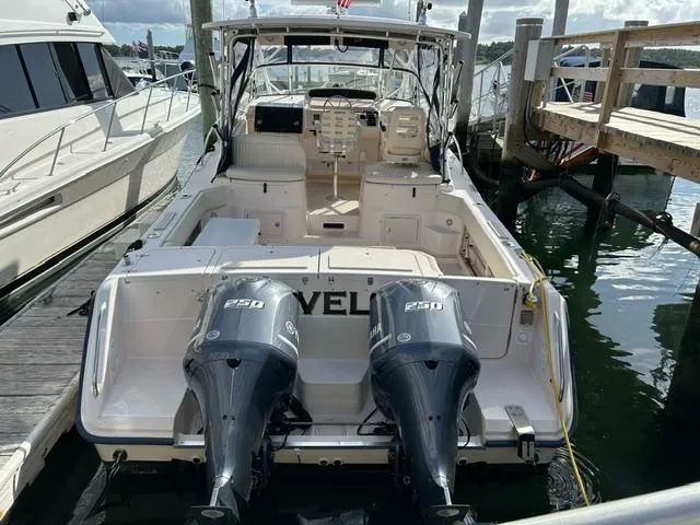 Slide: The Image of 2003 Grady-White 330 Express boat docked with twin 250 engines. - 3