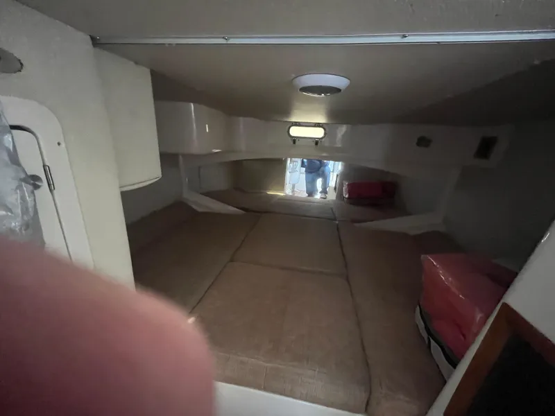 Slide: The Image of Interior cabin of 2003 Grady-White 330 Express boat, featuring cozy sleeping area. - 42