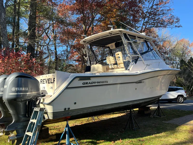 Slide: The Image of 2003 Grady-White 330 Express boat on stands, Yamaha engines, autumn background. - 6