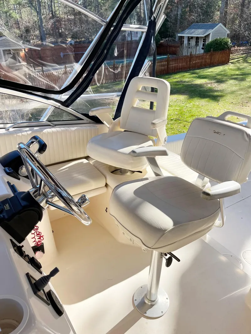 Slide: The Image of 2003 Grady-White 330 Express boat interior with helm and seating. - 9