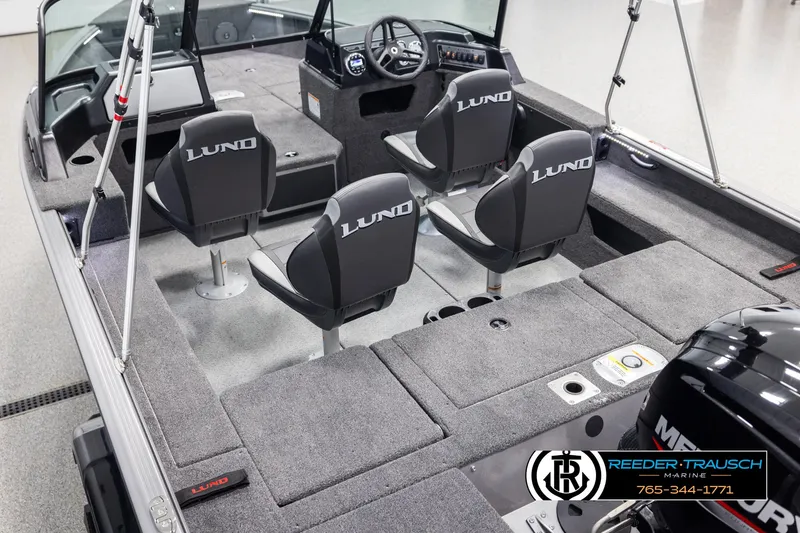 Slide: The Image of 2025 Lund 1775 Impact XS boat interior with four seats and steering console. - 11