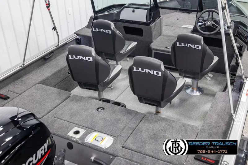 Slide: The Image of Interior of 2025 Lund 1775 Impact XS boat with four seats and steering console. - 12