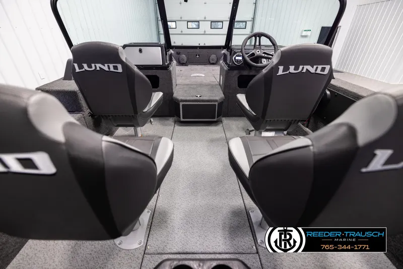 Slide: The Image of 2025 Lund 1775 Impact XS boat interior with four seats and steering console. - 13