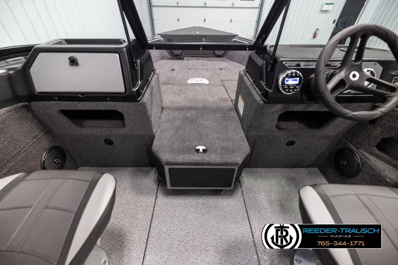 Slide: The Image of 2025 Lund 1775 Impact XS boat interior with modern dashboard and seating. - 14