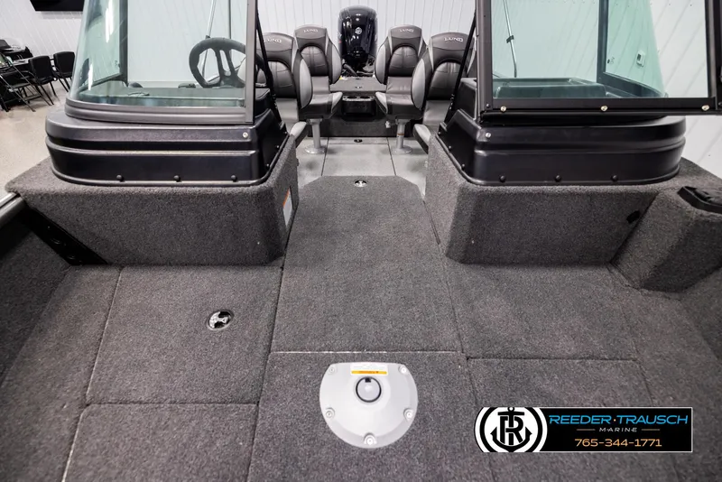 Slide: The Image of 2025 Lund 1775 Impact XS boat interior with seating and steering console. - 16