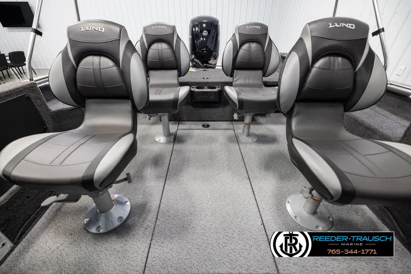 Slide: The Image of 2025 Lund 1775 Impact XS boat interior with four gray seats. - 17