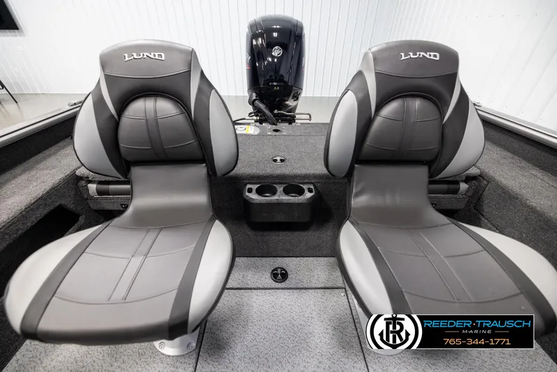 Slide: The Image of 2025 Lund 1775 Impact XS boat interior with two seats and motor. - 18