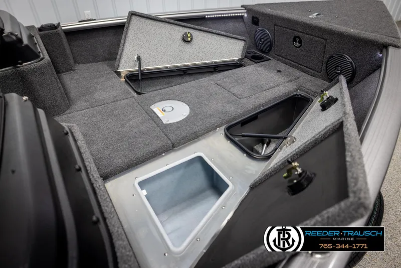 Slide: The Image of 2025 Lund 1775 Impact XS boat interior with storage compartments and speakers. - 20