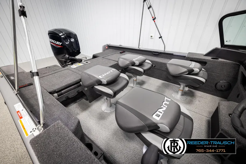 Slide: The Image of 2025 Lund 1775 Impact XS boat interior with seating and Mercury engine. - 22