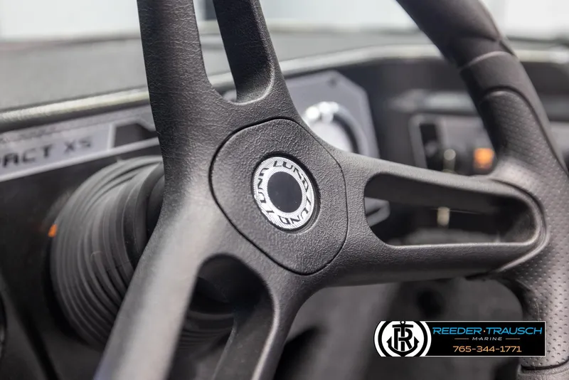 Slide: The Image of Steering wheel of 2025 Lund 1775 Impact XS boat, close-up view. - 26