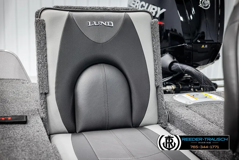 Slide: The Image of 2025 Lund 1775 Impact XS boat seat with Mercury engine in background. - 32
