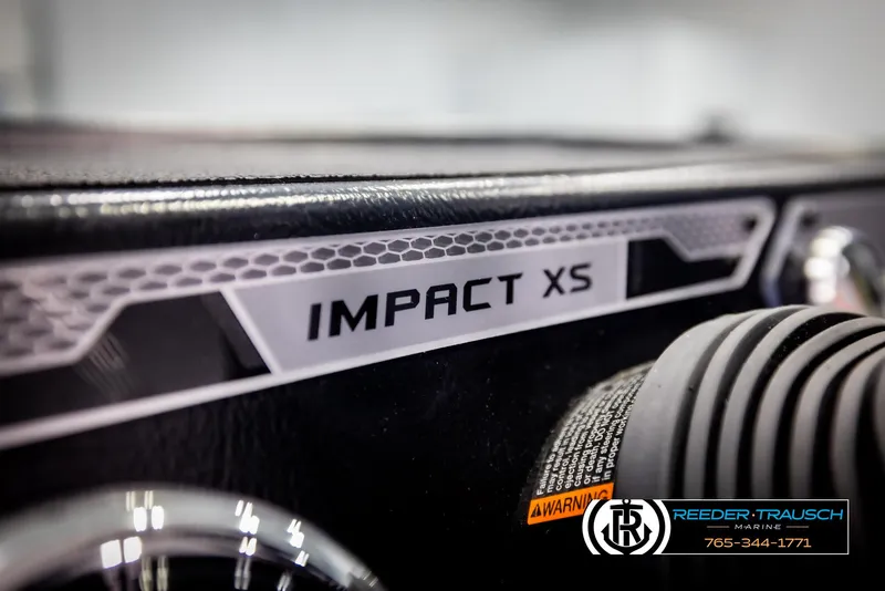 Slide: The Image of 2025 Lund 1775 Impact XS dashboard close-up with branding details. - 38