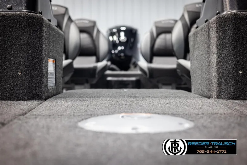 Slide: The Image of 2025 Lund 1775 Impact XS boat interior with carpeted flooring and seating. - 40