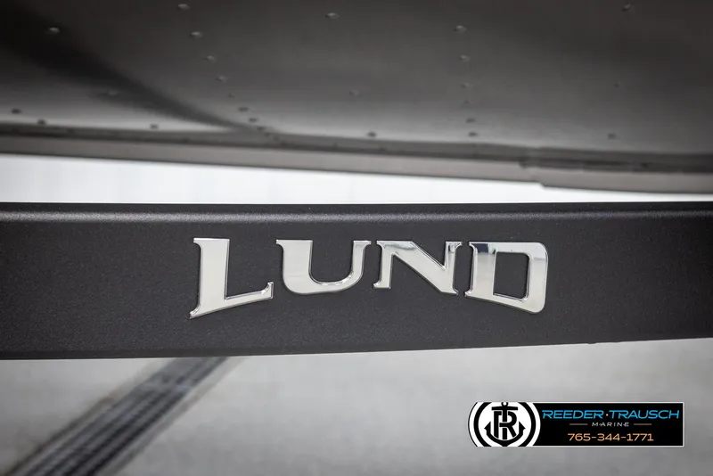 Slide: The Image of 2025 Lund 1775 Impact XS boat logo on trailer, Reeder-Trausch Marine branding. - 48